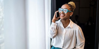 Smiling black female talking on the phone