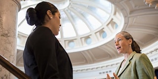 Politicians talking in government building