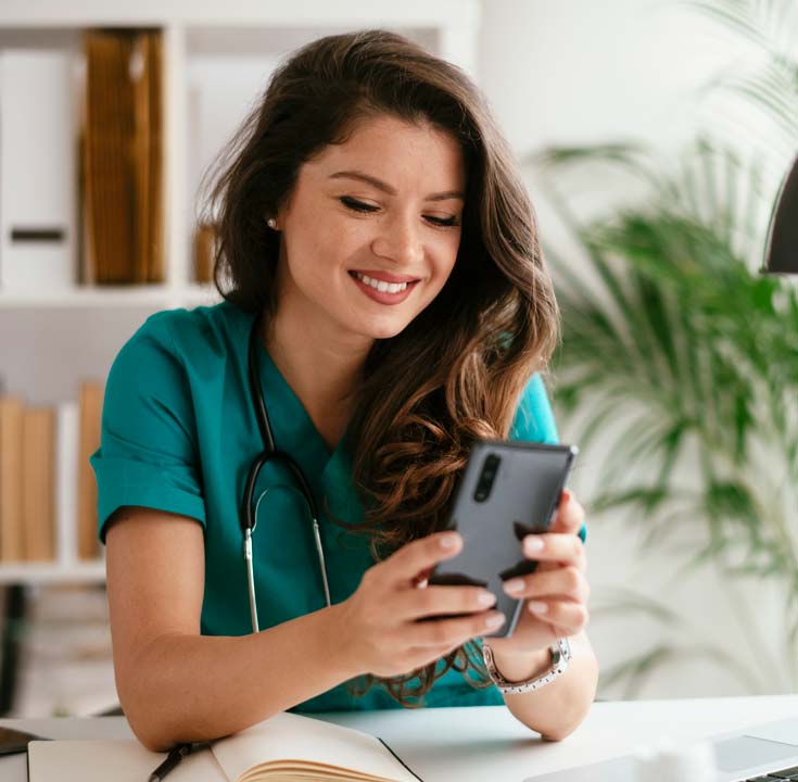 Doctor using her mobile phone