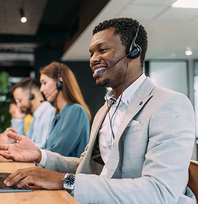 African American male contact center agent in a call center taking a call