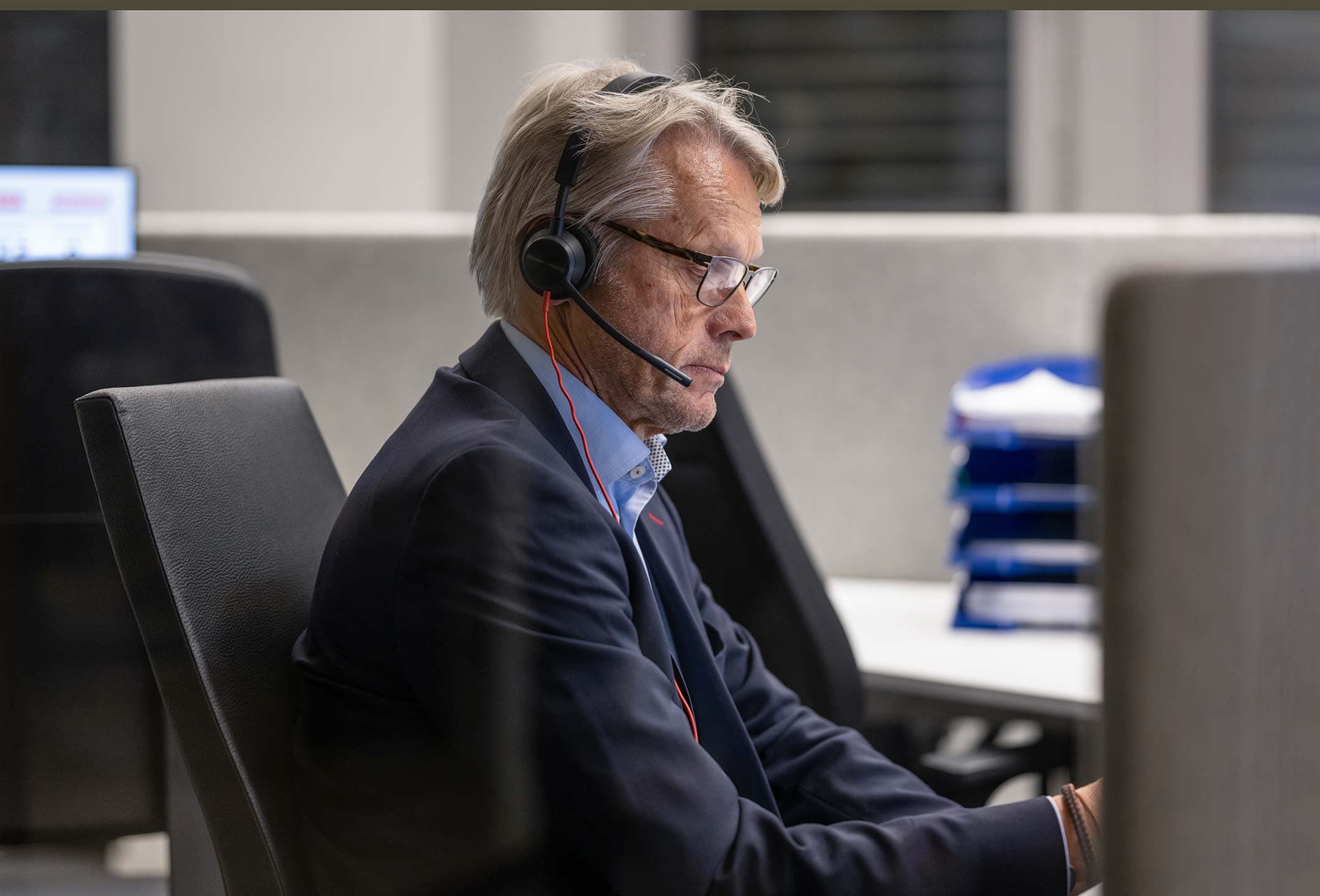 Senior businessman working in call center