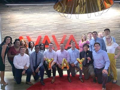 Large group photo of Avaya team members