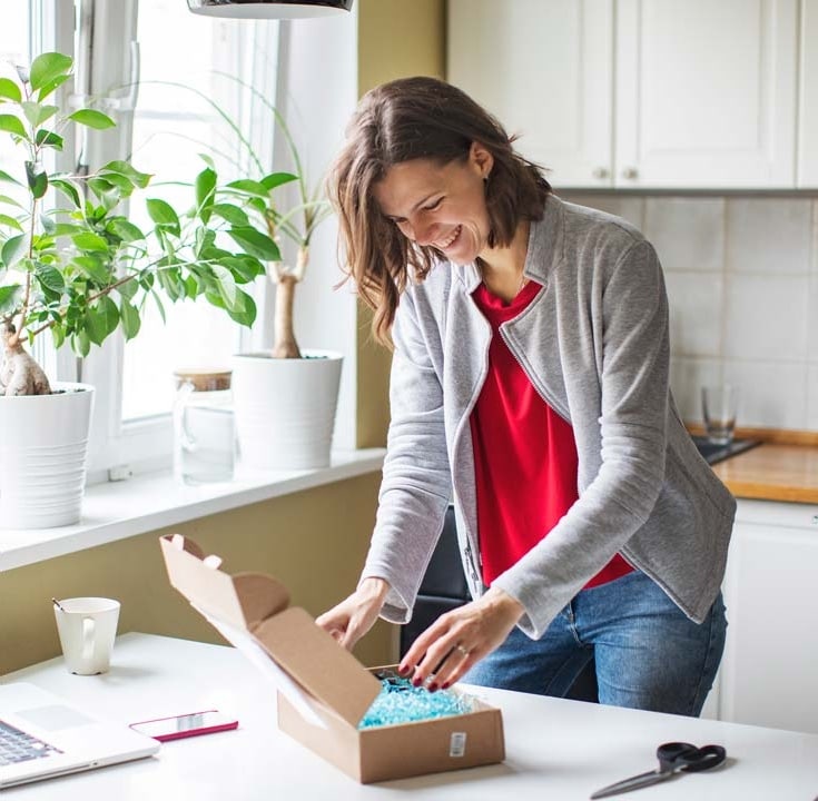 Woman opening a package