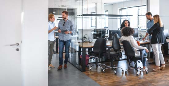 A small business group discussions in open plan office.