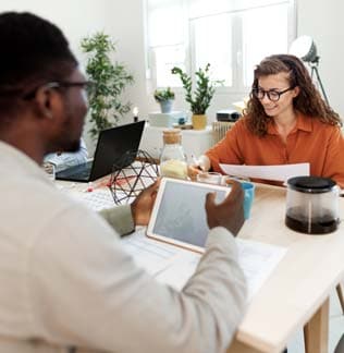 Man and woman working together at a desk