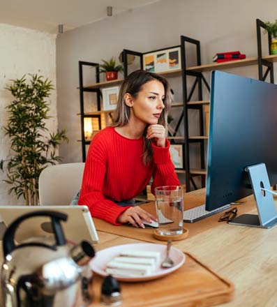 Woman sitting in front of a computer