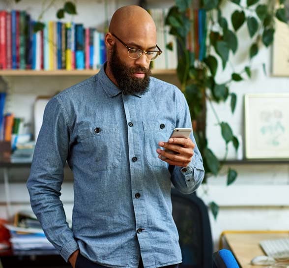 Man reading a text message