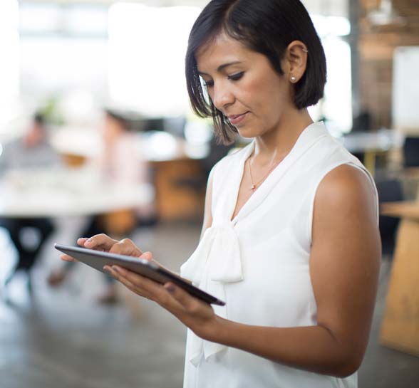 Woman scrolling on a tablet