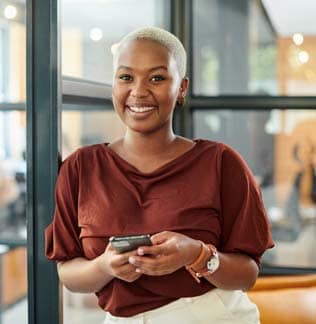 Businesswoman using a smartphone in a modern office