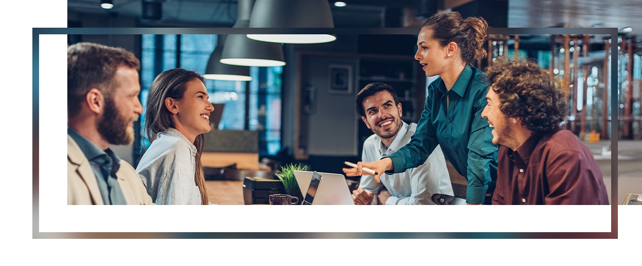 Group of employees talking in an office