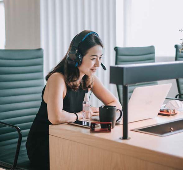 Asian contact center worker working from home