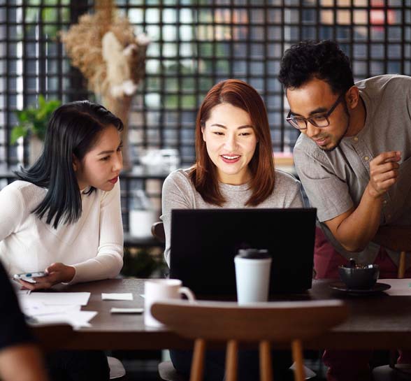 Group of employees working on computers