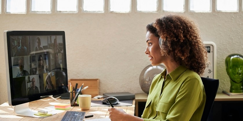 Woman working in a call center with a male colleague.