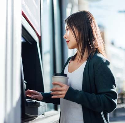 Woman withdrawing cash at the ATM