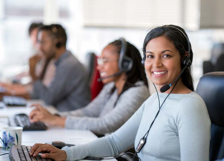 Portrait of a female call center agent working in her office