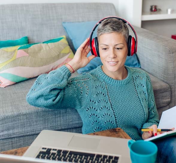 Woman working with clients online from her living room