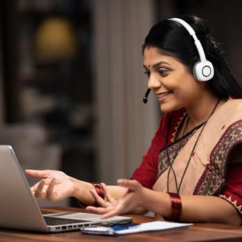 Customer care representative sitting on chair at home