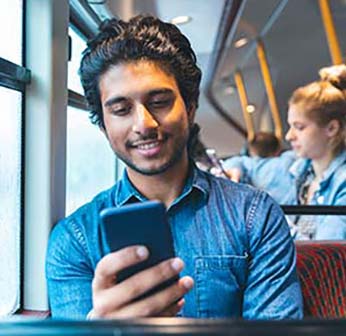 Man having a call while riding public transportation