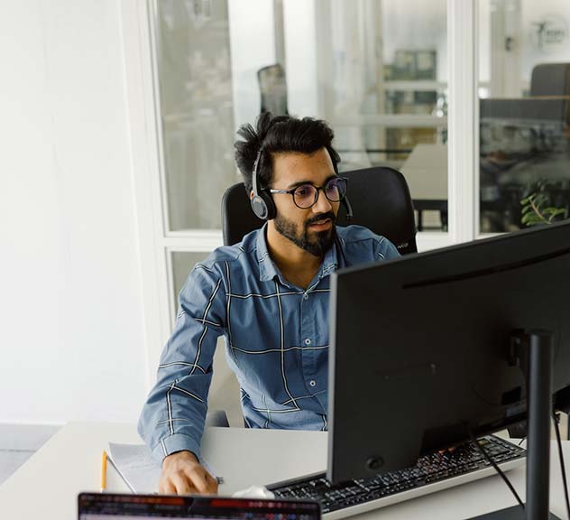 Contact center agent at his computer