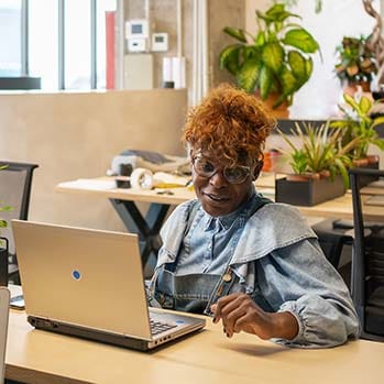 African American woman working on her laptop