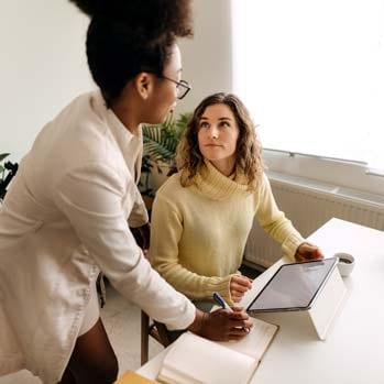 Two business women working in office