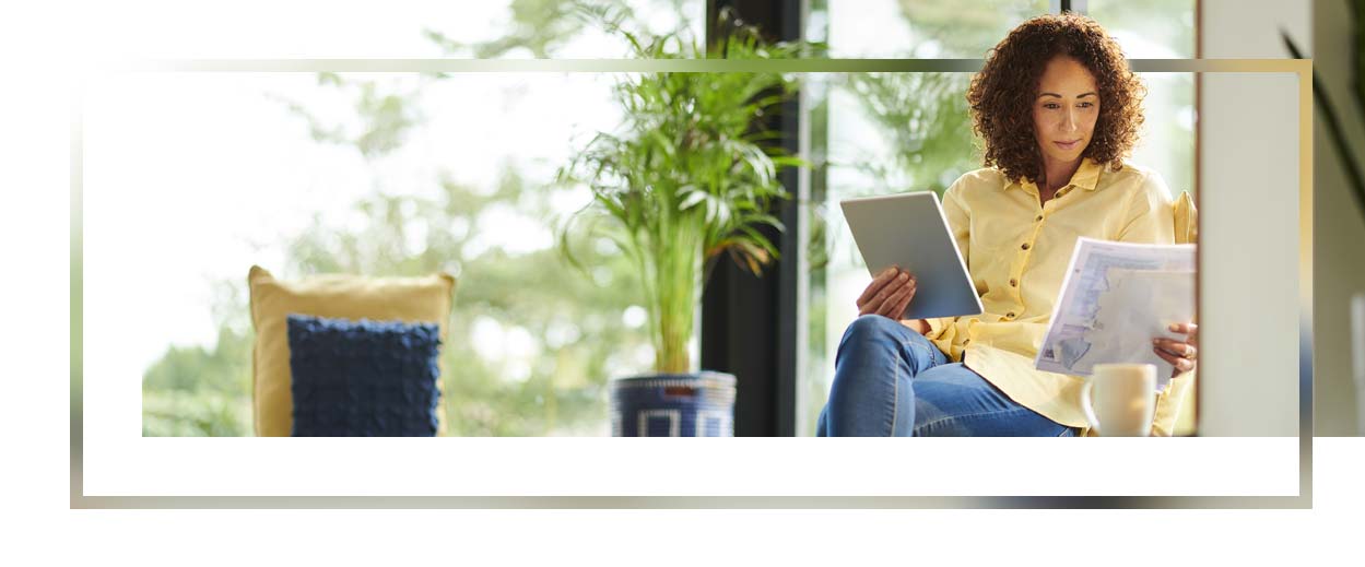 Woman paying bills online at home.