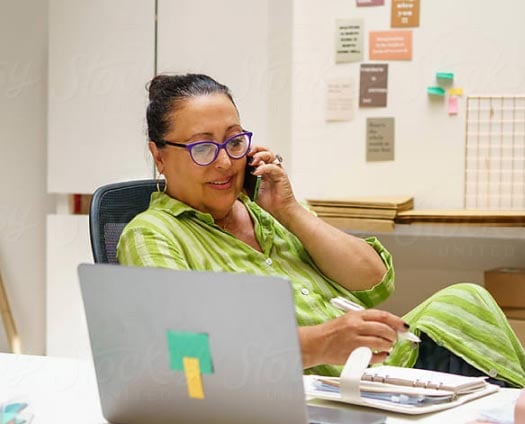 Business woman on the phone at her desk