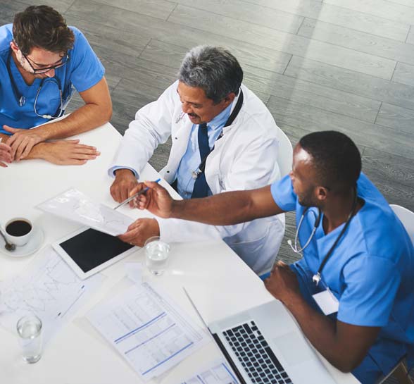 Medical personnel sitting around a table