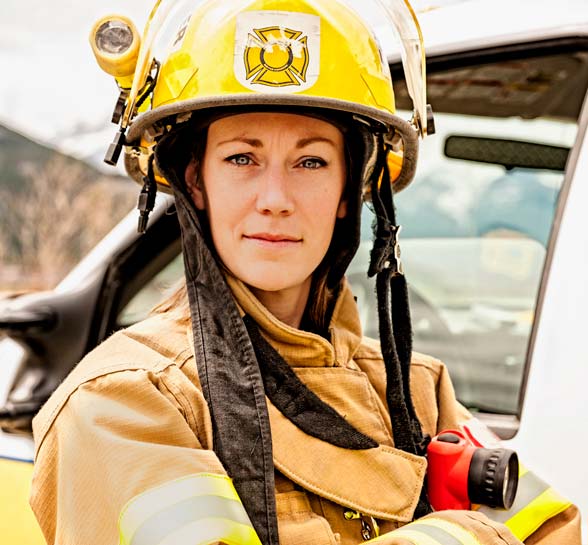 Emergency services work stands beside fire truck