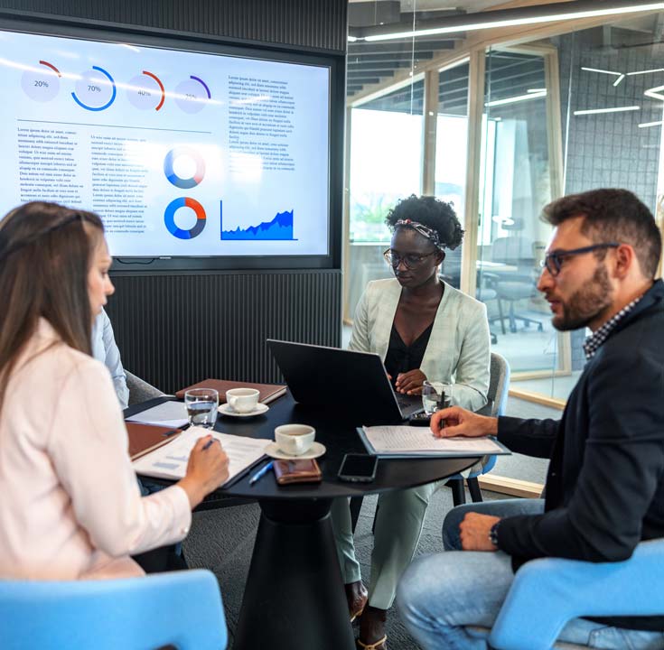 Three colleagues working together in an office