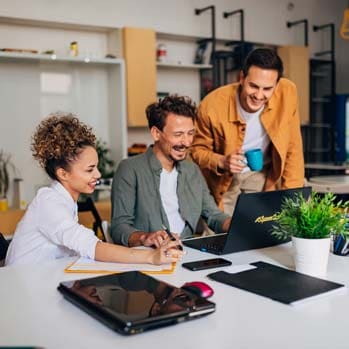 Group of people working on laptop