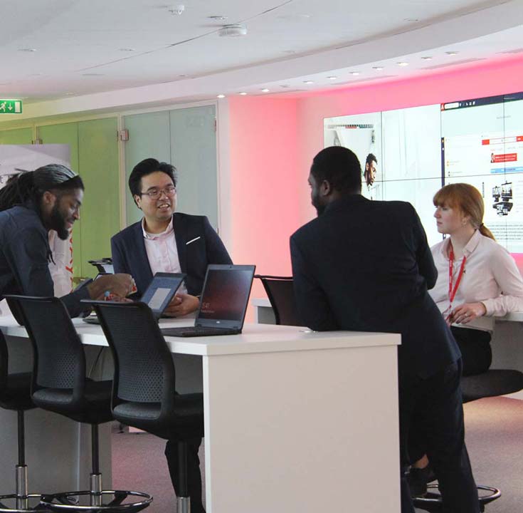 Avaya staff working together in the Executive Briefing Center