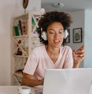 Woman with headset talking during an online meeting