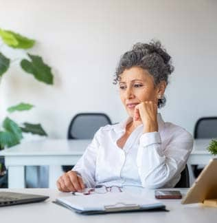 Woman working in modern glass office